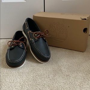 women’s leather slip on shoe by Timberland; navy blue